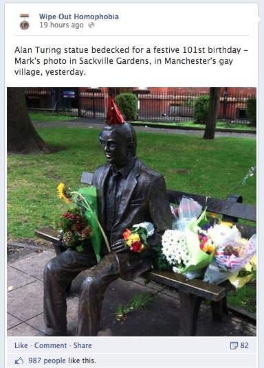 Alan Turing's Statue surrounded by flowers